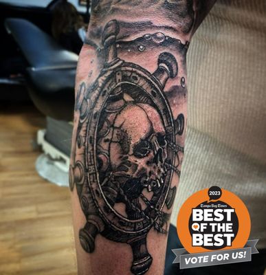 Black and Grey Skull Ship Helm Tattoo by Legendary Bob Braden