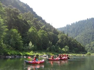 "Duckies" in foreground as ROW preps a trip on the Rogue River.