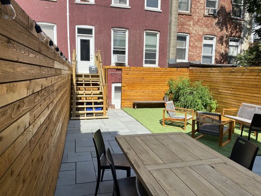 Red cedar fence, bluestone patio, artificial grass, outdoor kitchen, steps and landing