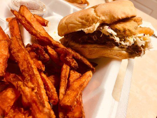 Awesome pulled pork sandwich with fried pickles & sweet potato fries. Outstanding!