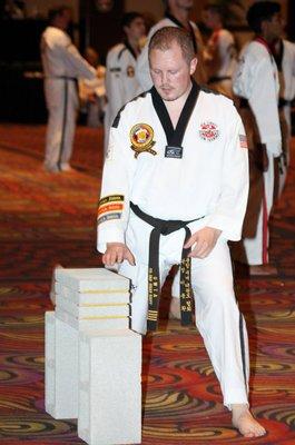 Master Brian Kropp, testing for 5th degree black belt.