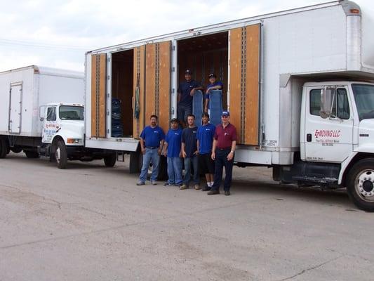 E-Z Moving & Storage trucks and personnel.