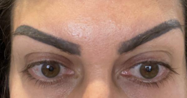 Black sharpie marker brows done by Honeybrows.