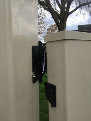 Gate door hinge broken off from fence.