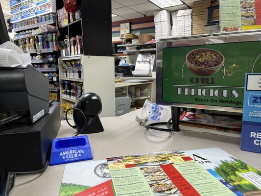 Convenience store counter,  pizza ordering spot