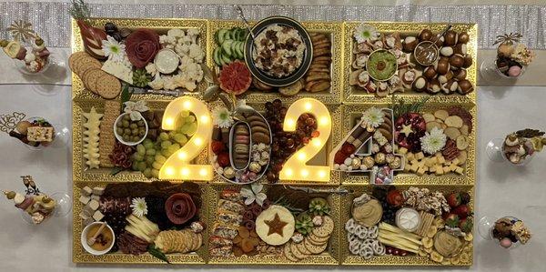 Custom New Year's Eve pairing tray ensemble with charcuterie martini glass accompaniments