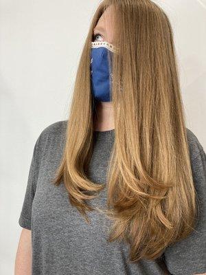 Long layered haircut and smooth blowout