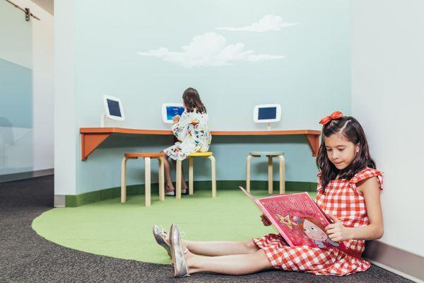 Child-friendly play room with Ipads to make your child's experience more comfortable