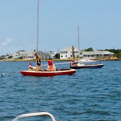 Our historic Cape Cod Knockabouts are comfortable and stable in the water.  They are used for instruction and racing with spinnakers.