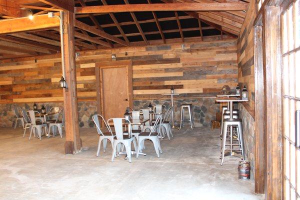 Barn Interior Metal tables, chairs, & bistros with stools.