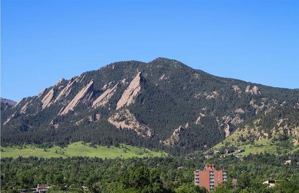 The breathtaking Flatirons view from the Boulder office rooftop patio.