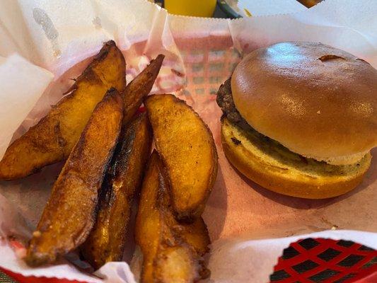 Burger with potato wedges. The burger comes with no toppings for some reason. $9