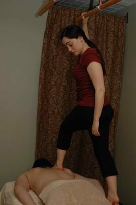 Amanda Collado,L.M.T. Doing Ashiatsu Massage with one of her athletes.