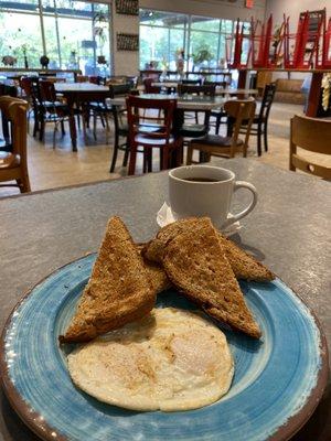 Two eggs over medium with wheat toast. Perfectly cooked and sooo delicious.