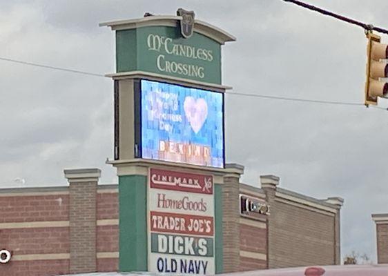 A sign at the entrance to the shopping center