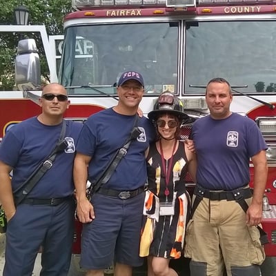 Children's librarian with local firefighters at the library.