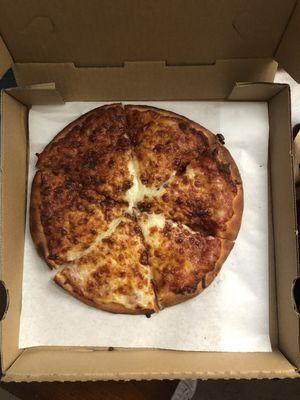 Cheese Pizza, smaller than a personal size and burnt.