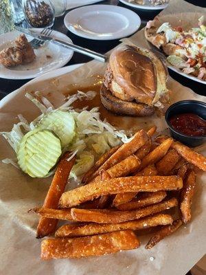 fried chicken sandwich with maple sauce and sweet potato fries