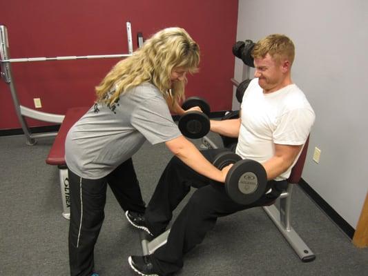 Lisa helping a client get the most out of curls.