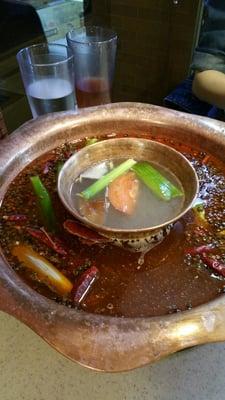 Two-flavor hotpot - Sichuan-style (outer ring) and classic (inner pot)