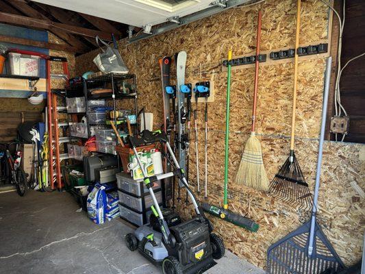 Lawn care, tools, and skis organized