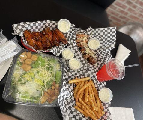 12 Piece Wings split 6 Asian Zing 6 Garlic Parm Seasoned Fries Caesar Salad Red Drink