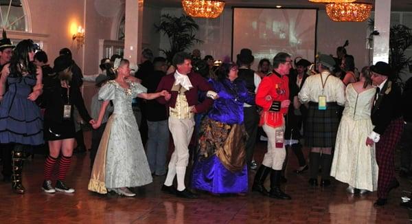 Attendees dance at the formal ball