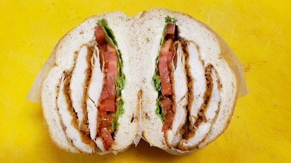 Chicken cutlet on a roll with lettuce and tomato!