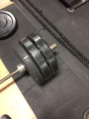 Bumper plates at the designated Olympic lift station