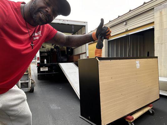 Me using my equipment to safely move a heavy 75 inch dresser