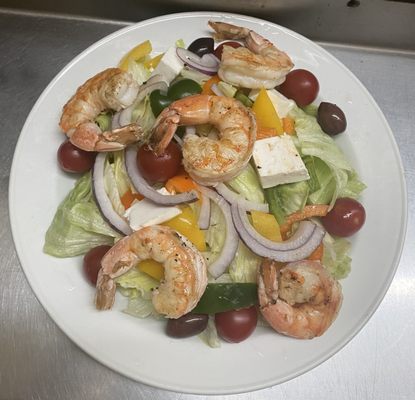 Grilled shrimp over house salad.