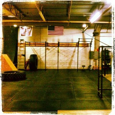 Front view of the gym. Here you can see one of our pullup rigs, tractor tires, and the infamous 14 ft. warped wall.