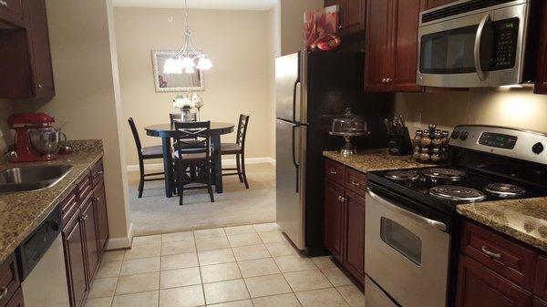 all kitchens have granite and cherry cabinets