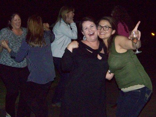 After dinner and dark, these girls danced outside under the dance lights.