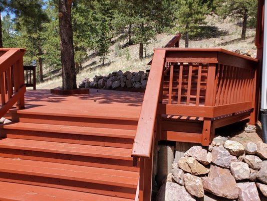 This is only a portion of a very weathered redwood deck that PrimeCo Exteriors refinished and stained.  Looks great!