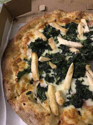 White pizza with chicken and spinach