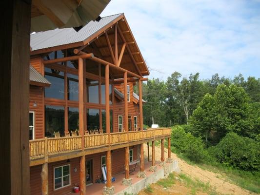 Three story lodge has floor to ceiling views of the lake.