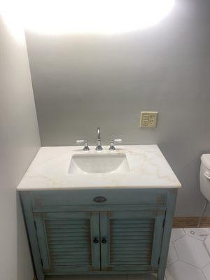 New vanity cabinet and faucet