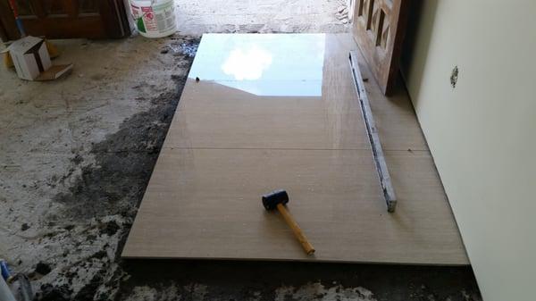 Starting phase of a 4ft x 2ft Porcelain tile floor.