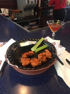 That's what $20 looks like. Pitiful wings and watered down cocktail.