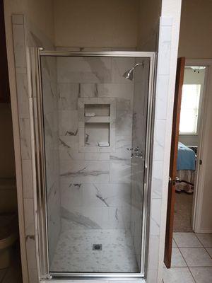 Remodeled shower with glass door