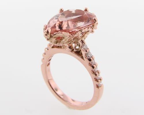 Offbeat bride morganite and diamond engagement ring in pink/rose gold with a lace setting.