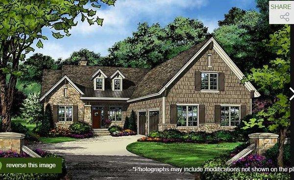 A metal accent roof and twin dormers top this rustic ranch with courtyard garage. A classic dining room serves as a focal poi...