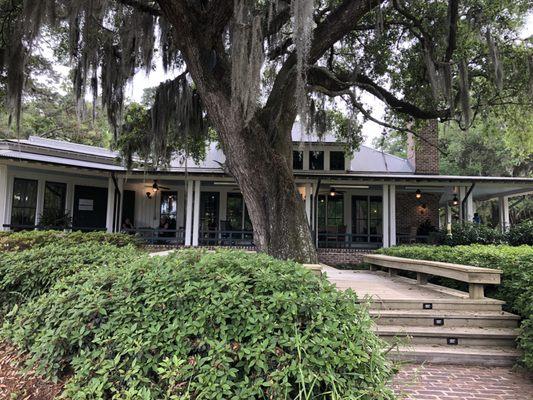 Exterior of Clubhouse with beautiful wrap-around porch for outside dining.