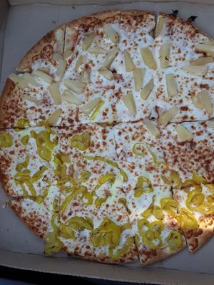 Custom pizza ready in less than 8 minutes; thin crust, light sauce, half banana peppers and half pineapple.