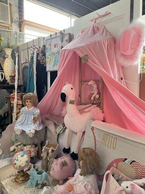 Pink canopy and stuffed animals to help decorate a beautiful little girls room.