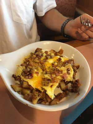 Meat Lovers skillet with scrambled eggs and breakfast potatoes.