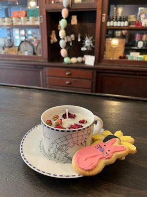 A candle in a teacup, created at our Candle Making Workshop. Accompanied by Jennifer-jo's homemade cookies.