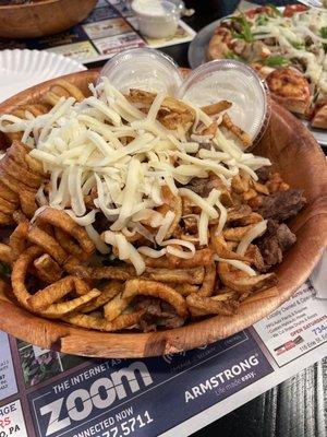 Steak salad with curly fries and ranch dressing