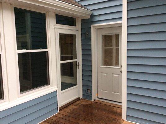 Windows, Siding, Storm Door, Back Door with blinds, and Gutters